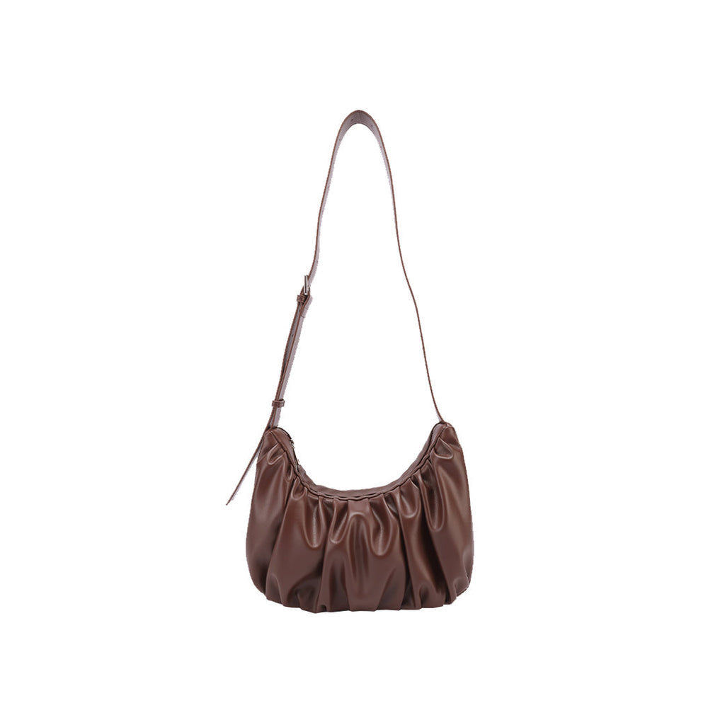 Chara | Croissant-shaped leather sling bag